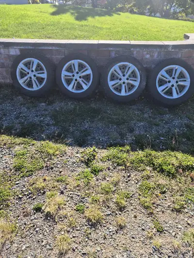 Four Nissan steel rims with Nissan TPMS. Studded P205/60/16 winter tires and Nissan hubcaps. Four ho...