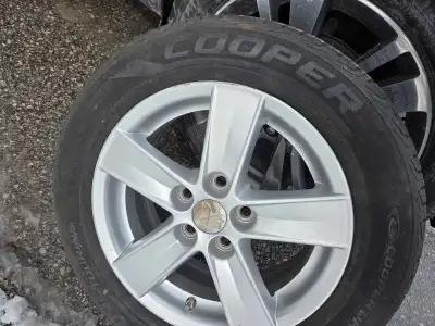 I am selling a set of four Cooper Grand Touring tires, size 205/60R16, mounted on rims. These tires...