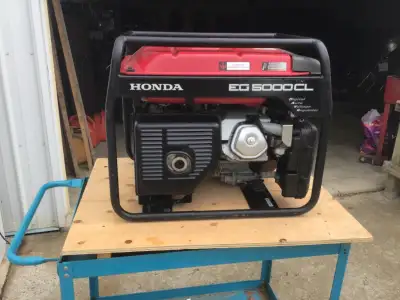 Honda EG5000CL generator with 2-120v 20 amp outlets 1-240v 30amp and 1-240v 18.8amp slightly used ap...
