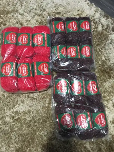 See pictures. Red yarn is each 100gram ball. The green and dark red is 50 gram ball each total 18 ba...