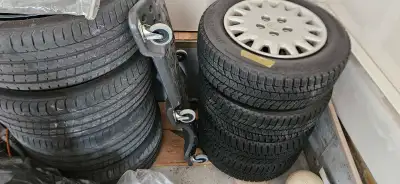 A set of Winter tires on 15inch rims i bearly used them on Honda then sold the car no need for them...