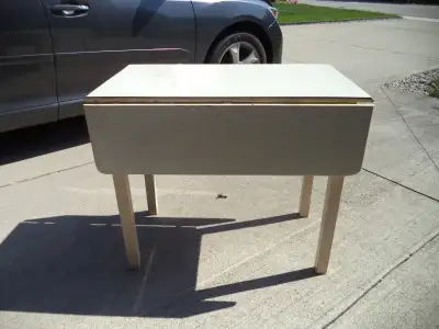 I have for sale a folding wing table it is 36 in across, 21 in front to back with wings down and 41...