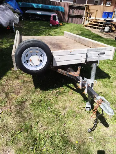8ft by 5ft utility trailer, working lights , spare tire and a tongue jack.