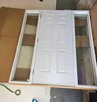 White front door with side glass panels, never installed 