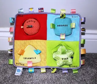 Taggies My First Puzzle Shapes Activity Center, View more