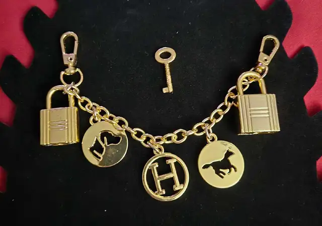 Hermes Gold Tone bag charm