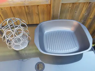 Rack holds 27 items. Frigidaire Roaster is approx. 17 by 14 inch. Porch pickup.