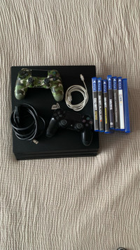 PlayStation 4 W/ Two Controllers & Games