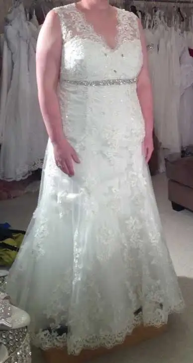 Wedding dress size 16 with lace-up back, View more