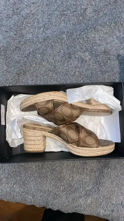 Selling a pair of Coach Sloan Sig Espadrille sandals in size 7.5. The colour is Khaki/Saddle. Comes...