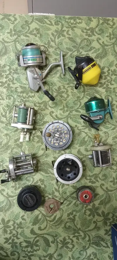Assortment of different fishing reels, selling as lot, located Paris Ont, pick up only