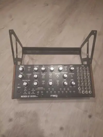 moog mother 32 with 2 tier stand, View more