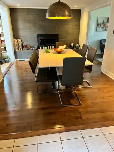 White, extendable table with pedestal footing. Size 71 x 41 inches. Built-in extension from center a...