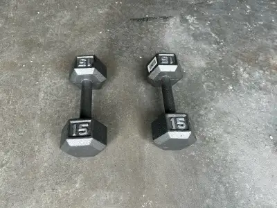 Get ready to pump some iron with these 15 lb dumbbells, perfect for your home gym or fitness routine...