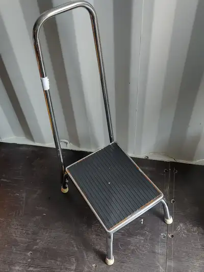 Sturdy metal step stool with handle for keeping balance, View more