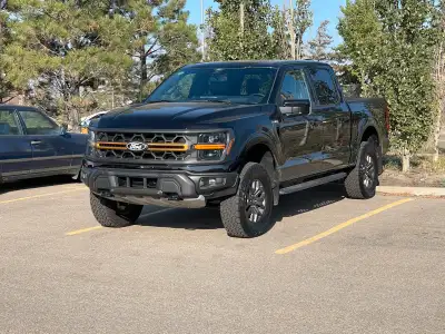 Agate black metallic. Full load, including power panoramic moonroof. Top line Tremor 402A package, i...