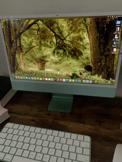 Barely used Apple iMac computer 24 inches with green colour design. It comes with alongside the keyb...