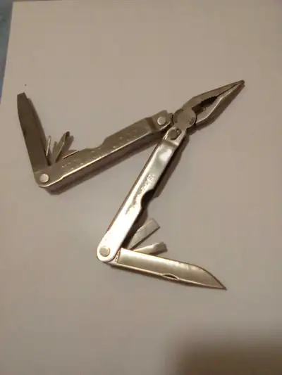 This is a high quality, Leatherman multi-tool, featuring pliers, multiple screwdrivers, and a knife....