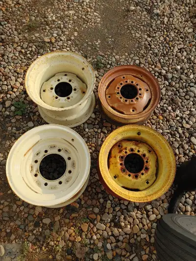 Four 15 inch rims. 15 x 5 six hole, yellow, used. 15 x 8 six hole, yellow, used. 15 x 10 six hole, o...