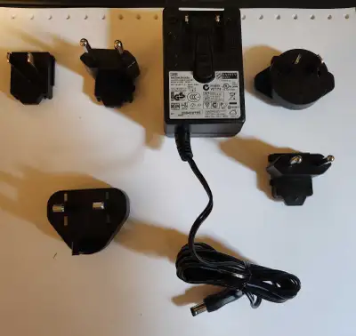 Brand new never used 12 volt 2 amp power adapter with connections for anywhere in the world.