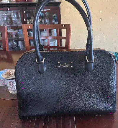 Crafted from premium, buttery-soft pebbled leather, this oversized satchel is the perfect bag for ev...