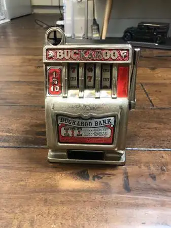 VINTAGE BUCKAROO 3-REEL SLOT MACHINE BANK MID CENTURY IN PERFECT WORKING CONDITION!! Accepts pennies...