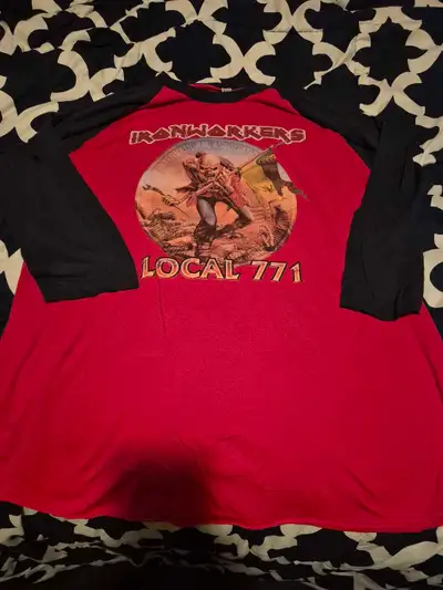 This is a used Ironworkers Local 771 T-shirt, perfect for fans or members. The shirt features a stri...