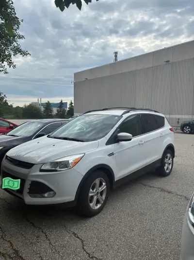 For sale: 2016 Ford Escape in white with 155,000 kms. Well-maintained vehicle with full dealership s...