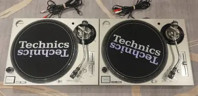 Pair of Technics SL-1200MK5 silver direct drive turntables. comes with brand new technics slip mats...