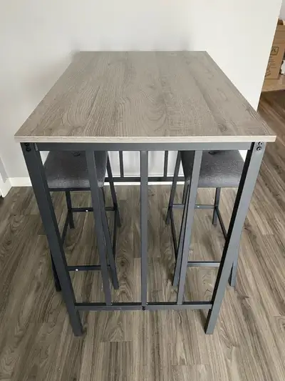 Almost new, hardly used. High top grey dining table and 2 stools. Excellent condition. Non-smoking a...