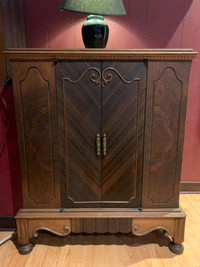 Beautiful antique wood cabinet with herringbone inlay on doors