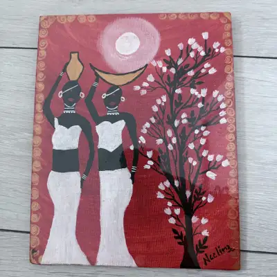 I'm selling this painting on canvas board, featuring a unique African-inspired design with women car...