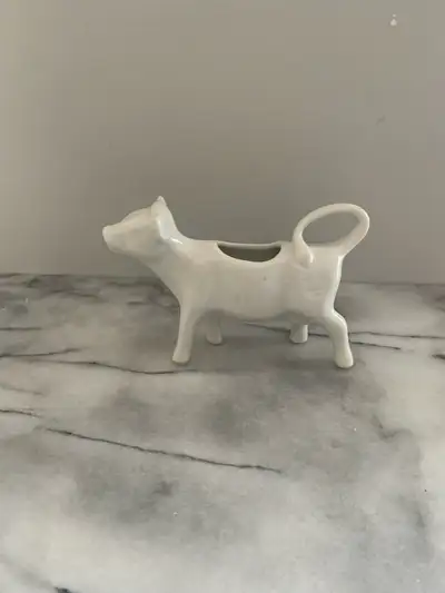 This adorable vintage cow creamer is ready to moo-ve into your kitchen! This piece is used, but stil...