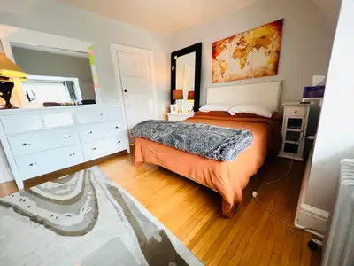 This is a large furnished master bedroom on the top floor of a charming century old home. This is a...