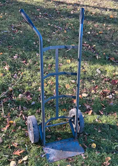 Move items with ease using this robust hand truck dolly. It's in used condition and ready to tackle...