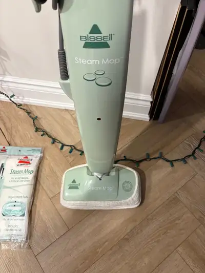 Bissell steam mop and 2 extra pads, View more