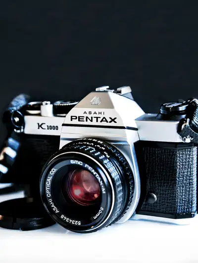I am selling the following item(s): - Pentax K1000 35mm SLR Film camera body with neck strap - SMC P...