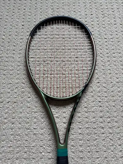 Wilson Blade 98 version 8, 16 x 19 string pattern. Replaced the stock grip with a black leather grip...