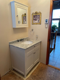 Bathroom vanity with sink and faucet