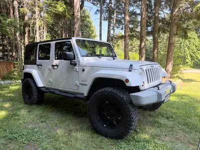 Selling my 2012 Jeep Wrangler Unlimited Sahar 4-Door. This has been a single-owner Jeep since new an...