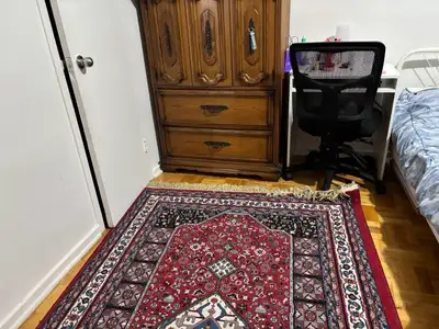 This cozy one-bedroom apartment features warm, traditional decor with beautiful parquet hardwood flo...