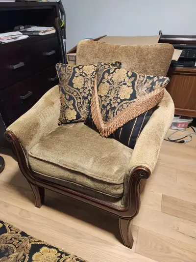 Beautiful stationary chair and matching designer ottoman. Comes with matching pillows