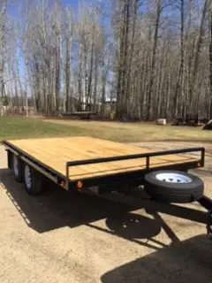Tandem Axle Utility Trailer with ramps. 7' wide x 12' long. Has 1 Breaking Axle. 14" Tires. Comes wi...