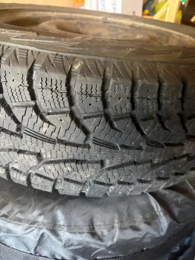 Four snow tires on rims 65R17