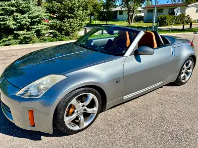 The 2006 Nissan 350Z Grand Touring Roadster is a two-seat sports car with a 3.5-liter V6 engine, pro...