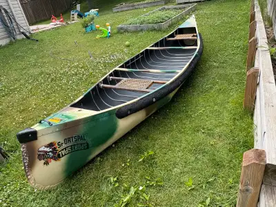 Sportspal 14-foot canoe, perfect for portages only weighing 41lbs. It can carry up to 800 lbs of car...
