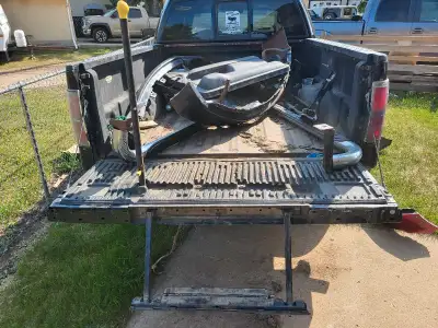 Tailgate with "old man" step from a 2009-2014 Ford F150. The paint isn't great, at all. The tailgate...