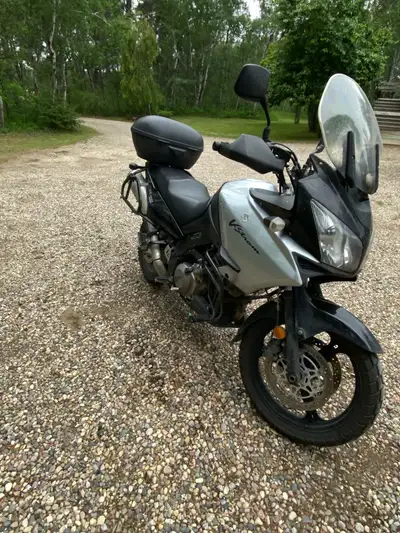 2008 Vstrom 1000. Has removable luggage racks. Tires at 50%. Has throttle lock, hand warmers, ram ph...