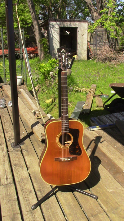 1968 Guild D40.. Action at 12th fret. Can put a quarter under the bass string, can Not put a quarter...