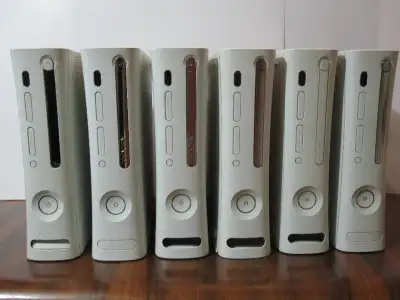 Six Xbox 360, one 360s, one 360E and one Play Station 2. Three 360 power supplies with AV cables, mi...